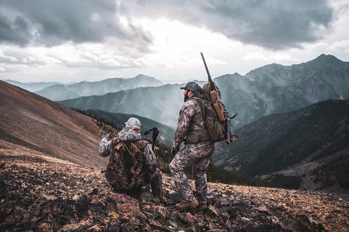 Snowy Mountain Rifle Co. Custom Long-Range Hunting Rifles Hunters scouting Montana backcountry — the terrain Snowy Mountain Rifle Co.'s custom long-range rifles are built for